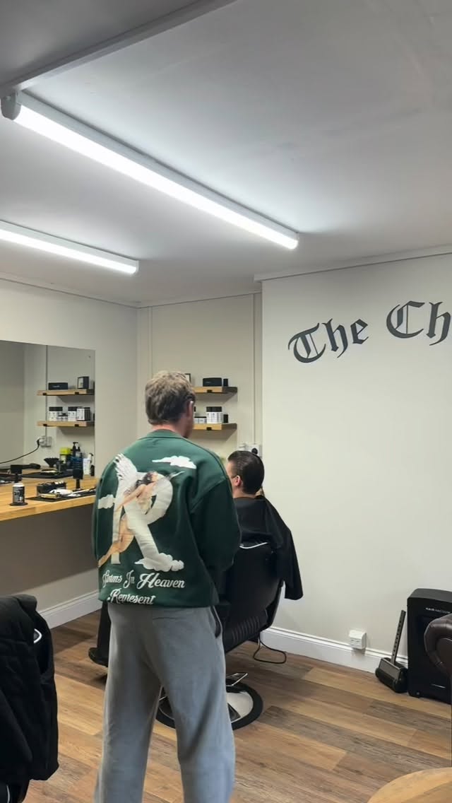 Lewis cutting hair at The Chair